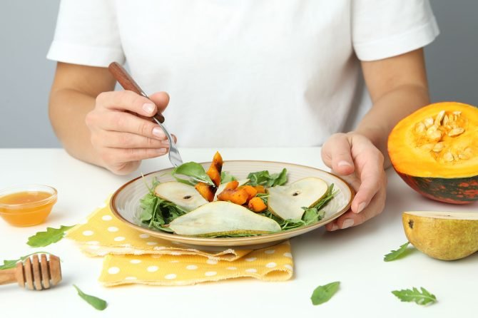 concept-of-tasty-eating-with-pumpkin-salad-on-whit-2022-01-19-00-21-55-53Y4VHR.jpg